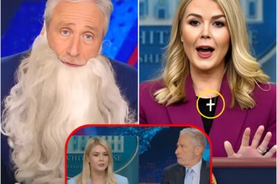 KAROLINE LEAVITT HUMILIATED BY JON STEWART — AND JUST DAYS LATER, SHE TOOK OFF HER CROSS NECKLACE. She finally ditched her signature necklace this week—right after Stewart torched her live on The Daily Show.